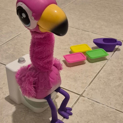 Flamingo Gotta Go interactive toy used, pink plush with electronic head