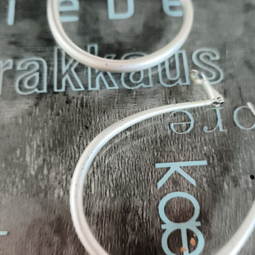 Modern earrings like new, silver color