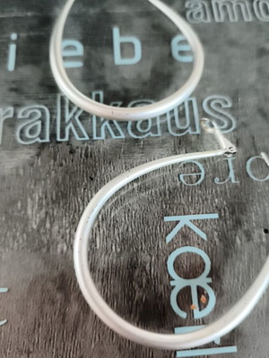 Modern earrings like new, silver color