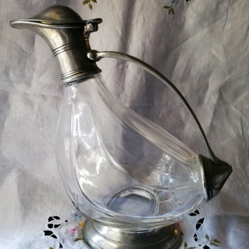Glass duck-shaped carafe used with pewter spout
