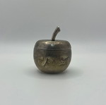 Small silver-plated apple-shaped case used