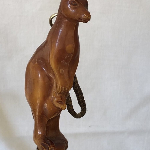 Shoe brush and shoehorn set used with kangaroo sculpture