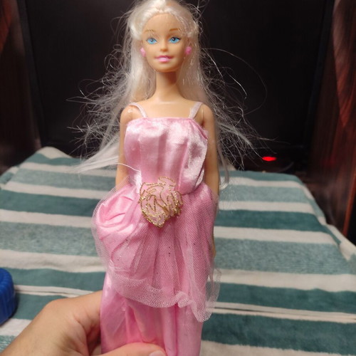 Barbie doll used with dress tears
