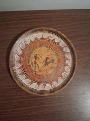 Decorative ceramic plate used with ancient Greek warrior design