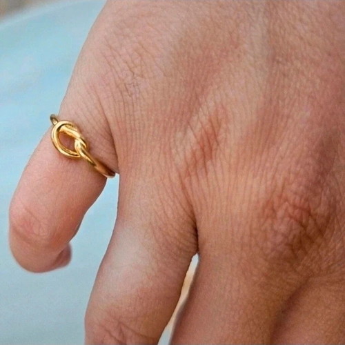 Steel chevalier ring new with knot design gold-colored