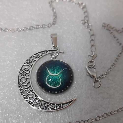Pendant necklace with Taurus zodiac and crescent moon, like new