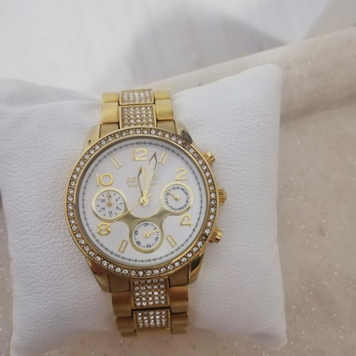 Revello women's watch new, gold color
