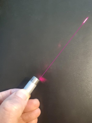 Laser keychain with strong beam and lens