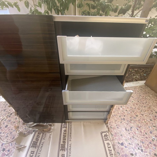 Wooden shelf unit used with adjustable shelves, dark finish