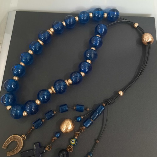 Decorative komboloi with large blue glass beads used, leather, bronze accents