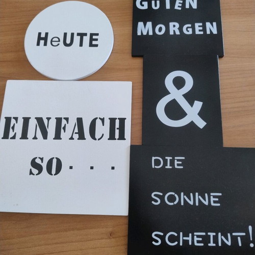 Wooden wall tiles with German words like new