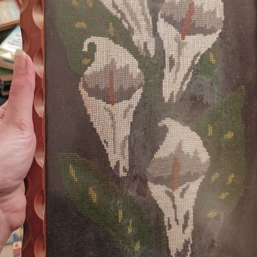 Vintage embroidery lilies in frame used with protective glass