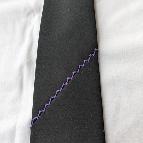 Dkny tie used polyester with lilac embroidery