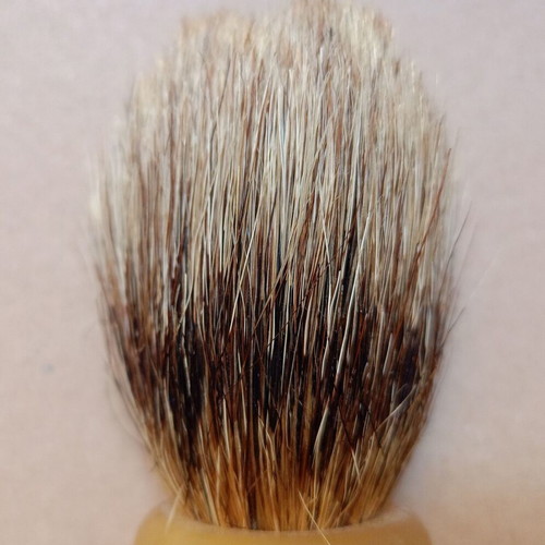 Two shaving brushes, one says it is made in West Germany.