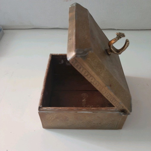Oriental copper box used with carved decorations