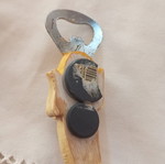Banana-shaped bottle opener magnet
