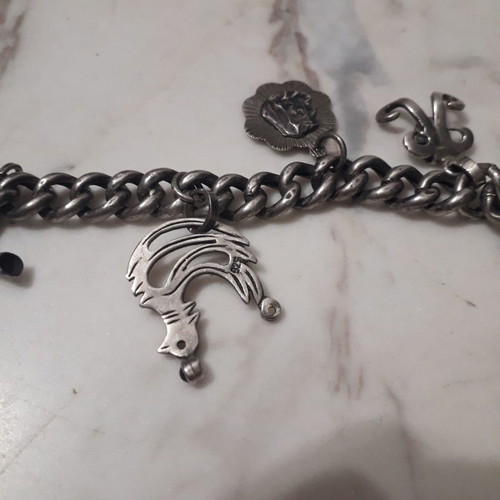 Vintage bracelet like new with silver hanging charms