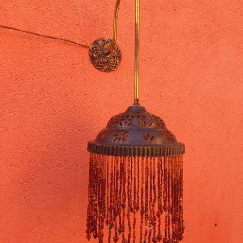 Wall light with beaded fringe