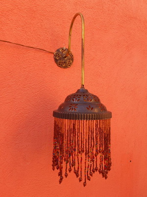 Wall light with beaded fringe