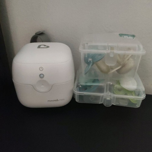 Munchkin pacifier sterilizer like new with cases and pacifiers
