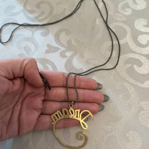 Dream necklace used with gray chain and gold pendant