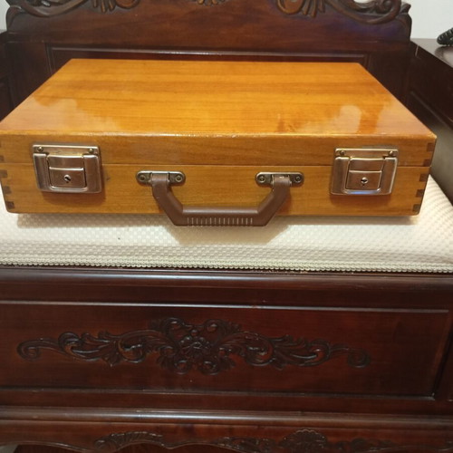 Vintage wooden suitcase made of genuine teak wood, used