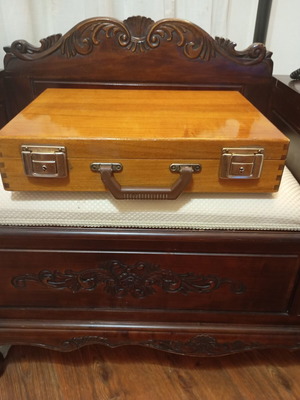 Vintage wooden suitcase made of genuine teak wood, used