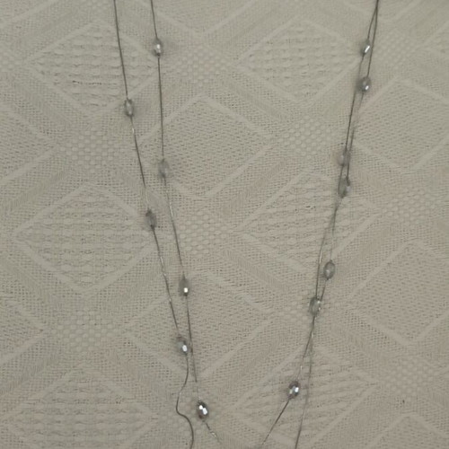 Long necklace used with white and silver beads