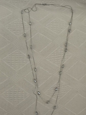 Long necklace used with white and silver beads