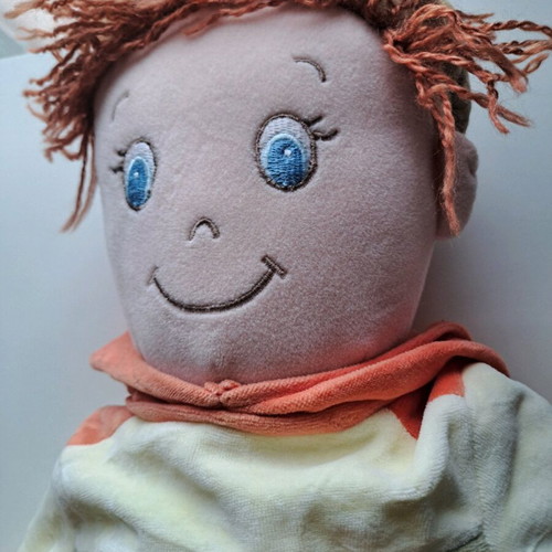 Cloth doll with hat and orange details like new