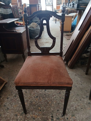 Vintage wooden chair used with brown velvet upholstery