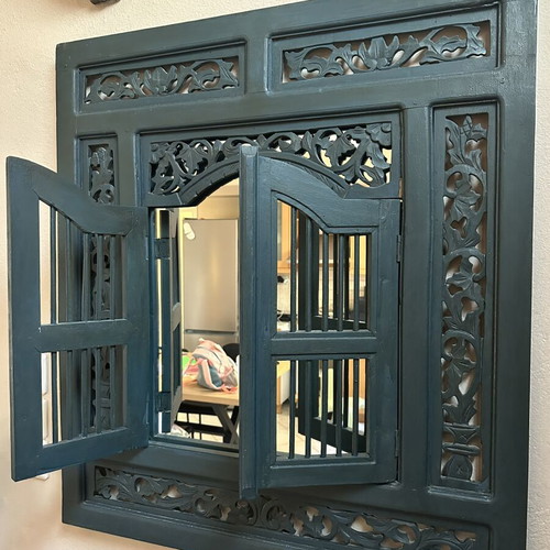 Handmade woodcarved window with traditional art design
