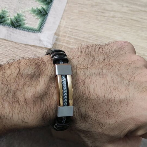 Stainless Steel Bracelet like new with gold chain and black rubber band