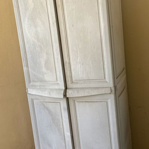 Keter plastic outdoor storage cabinet used, tall and functional
