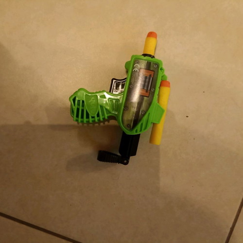 Small children's toy gun used with plastic darts