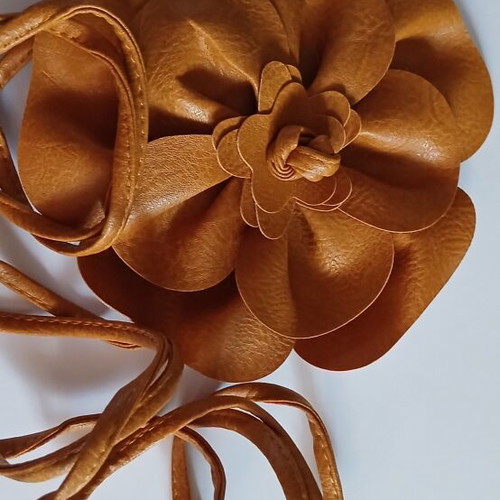 Belt made of faux leather with large tan flower, new