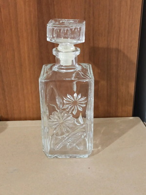 Glass bottle with embossed design like new