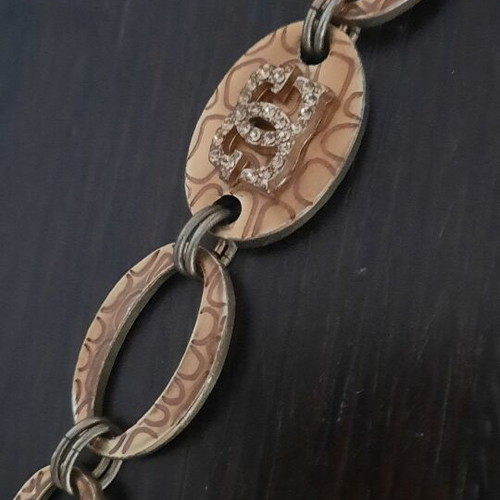 Guess vintage beige gold bracelet with rings and logo strass used