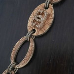 Guess vintage beige gold bracelet with rings and logo strass used