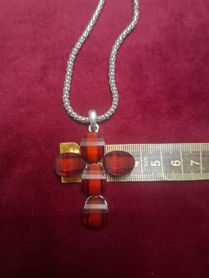 Cross pendant with silver chain, like new, deep red color