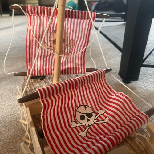 Wooden pirate ship used with small break and marker stains