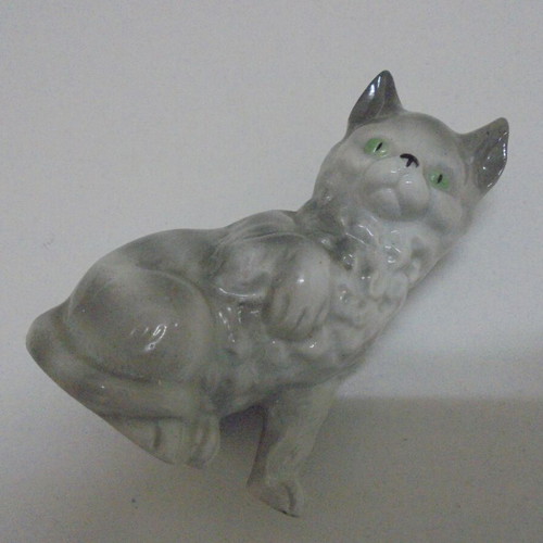 Vintage porcelain cat figurine, white-gray with green eyes