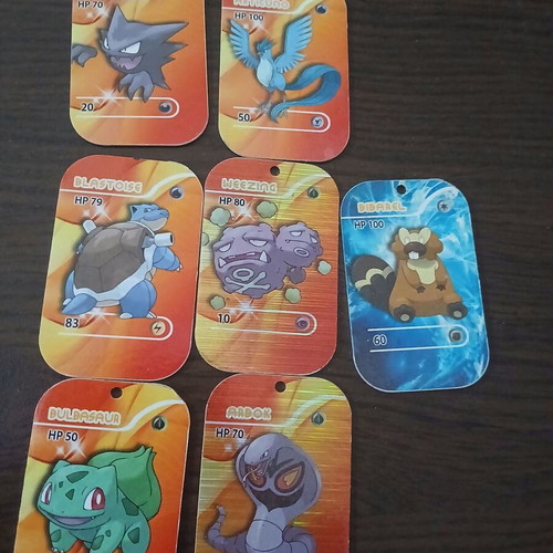 Pokemon large rare metallic tazos in like new condition