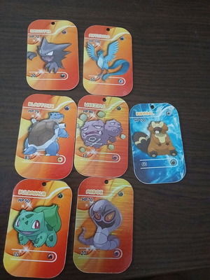 Pokemon large rare metallic tazos in like new condition