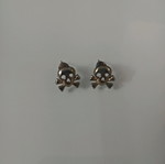 Skull earrings with yellowing