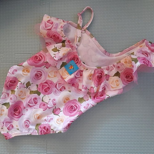 Children's swimsuit new by Tortue with floral pattern