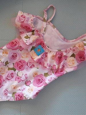 Children's swimsuit new by Tortue with floral pattern
