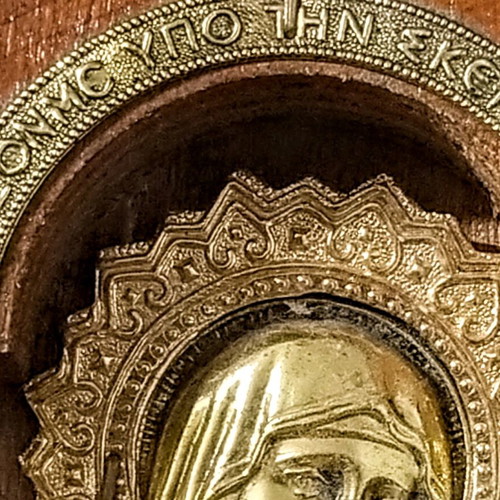 Vintage illuminated icon of Virgin Mary and Christ Child with lamp