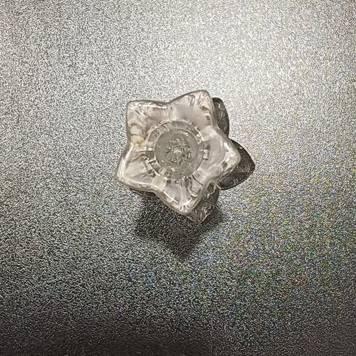 Tall crystal candlestick used with flower shape