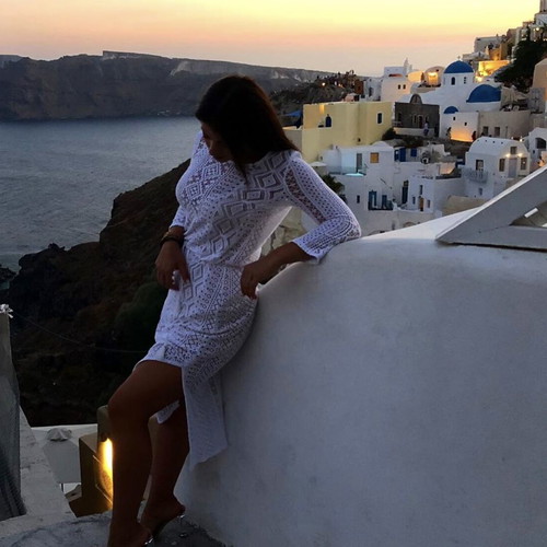 White midi crochet dress with geometric patterns and long sleeves